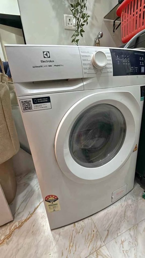 Angled front view of the Electrolux UltimateCare 300 8kg/5kg washer-dryer model EWW8024D3WB Scandinavian design and drum