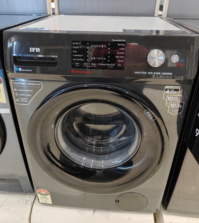 IFB EXECUTIVE OXN 9014 9 kg 5-star front-load washing machine on display, showing its digital control panel and round door