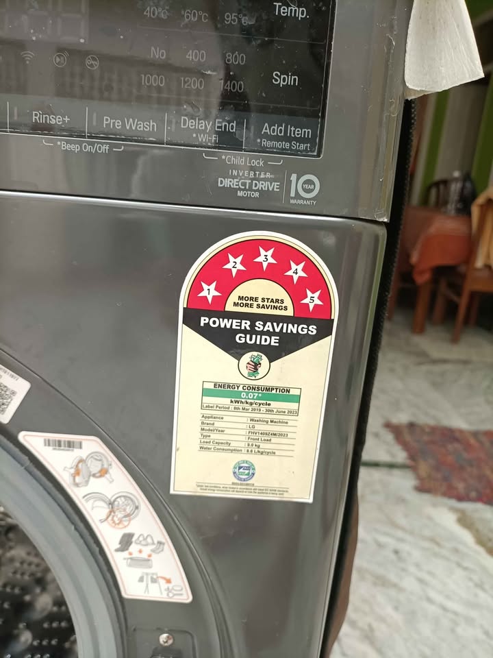 The LG 9kg Washing Machine displays the washing progress on an LED panel